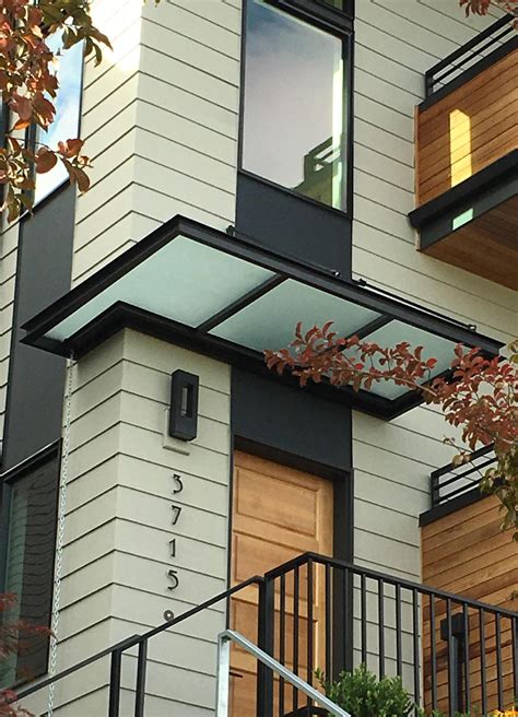 houses with metal window aweningns|modern window awnings.